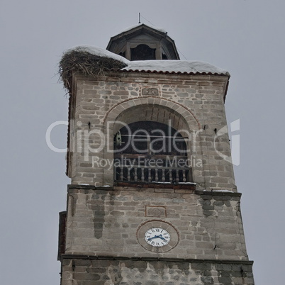Upper part of clock tower at church in Bansko town