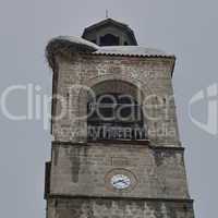 Upper part of clock tower at church in Bansko town