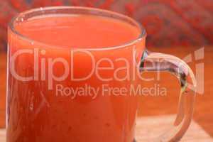 Fresh tomato juice in highball glass isolated on white
