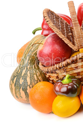 vegetables and fruits in a basket isolated on white background