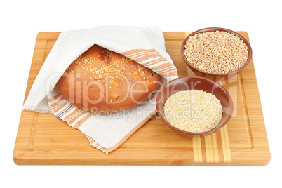 bread and wheat isolated on white background