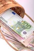 money set in a basket, dollars, euro and ukrainian money