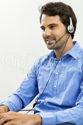 Man wearing headset giving online chat and support