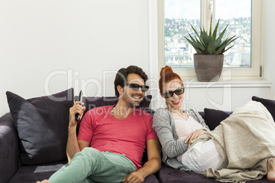 Sweethearts with 3d glasses Resting on the Sofa