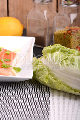 Slice of red fish salmon and fresh cabbage