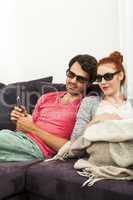 Sweethearts with 3d glasses Resting on the Sofa