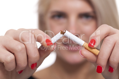 Close up Young Woman Breaking a Cigarette Stick