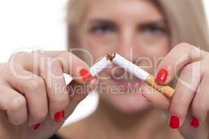 Close up Young Woman Breaking a Cigarette Stick