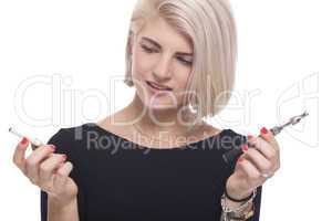 Blond Woman Holding a Tobacco and E-Cigarette