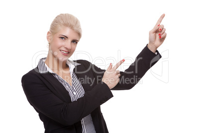Businesswoman Pointing Up While Looking at Camera