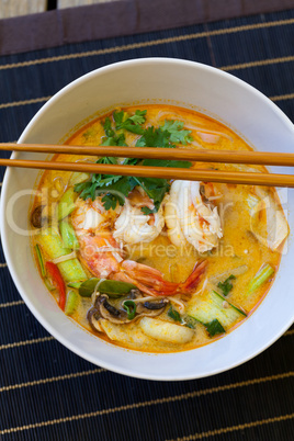 Bowl of traditional Thai tom yam soup