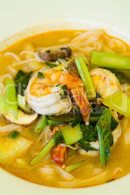 Bowl of traditional Thai tom yam soup