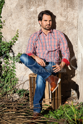 Male model sitting with legs crossed