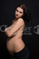 Pregnant woman posing nude