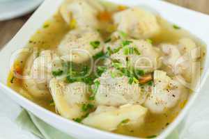 Dish of savory pork tortellini in broth pelmeni russian