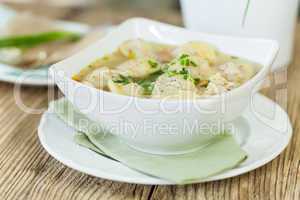 Dish of savory pork tortellini in broth pelmeni russian