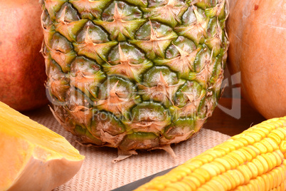 fresh pineapple with corn and orange