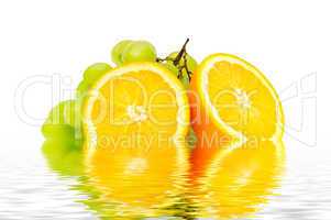 orange and grape reflected in water