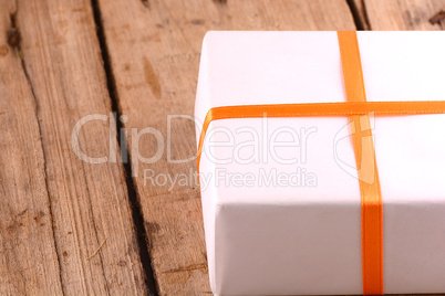 white gift box on wooden plate