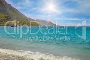 seascape, blue sky and mountainous coast