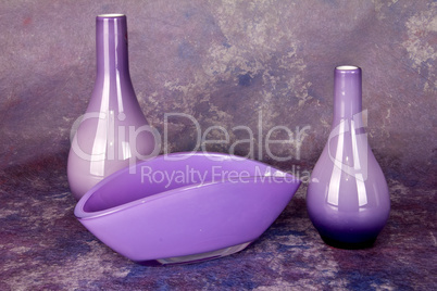 Still life with glass vases in violet tones
