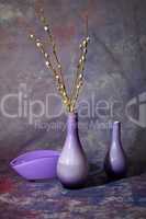 Still life with glass vases in violet tones