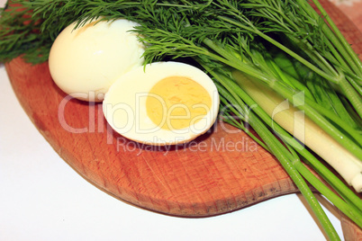 sliced boiled egg, green onions and dill