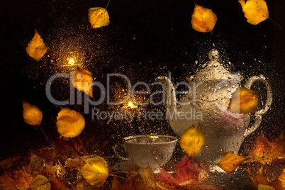 Autumn still life shot through wet glass