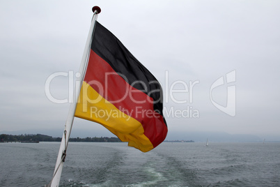 Flag of the Federal Republic of Germany on a flag pole