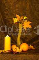 Vase with autumn leaves