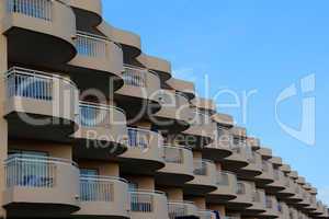 Windows and balconies. Modern house with many windows and balconies.