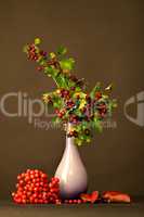 Vase with twigs and berries