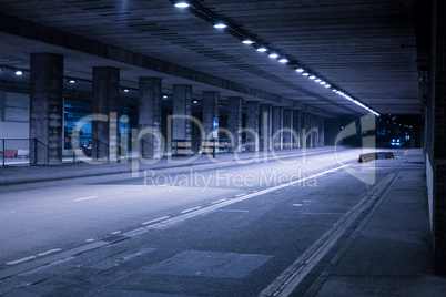 Covered Street Illuminated at Night