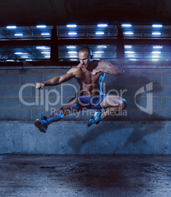 Athletic Man in Fighting Pose Inside a Building