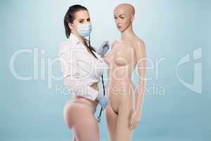 Sexy Female Nurse Standing Besides a Human Dummy