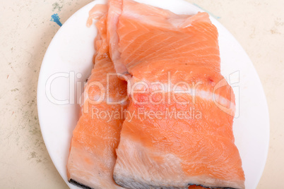 Fresh uncooked red fish fillet slices