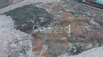Aerial Shot Landfill with Working Trucks and Tractor, top view