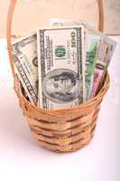 money set in a basket, dollars, euro