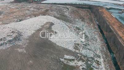 Aerial Shot Landfill with Working Trucks and Tractor, top view