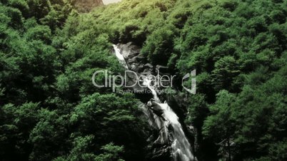 Flight over Waterfall in Forest