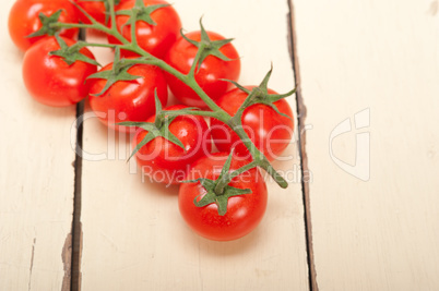 fresh cherry tomatoes on a cluster