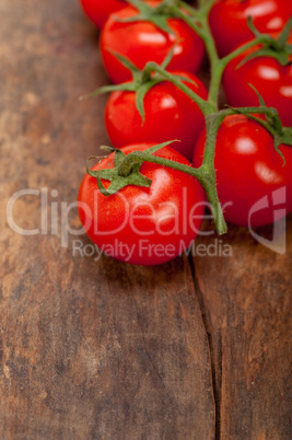 fresh cherry tomatoes on a cluster