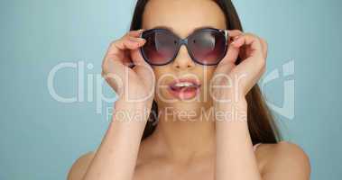 Cute vivacious woman in sunglasses