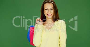 Happy female shopper carrying her purchases