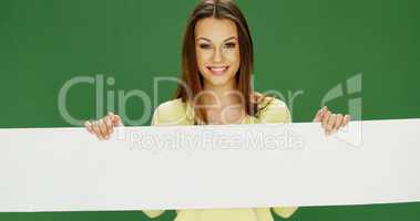 Smiling woman holding a long banner