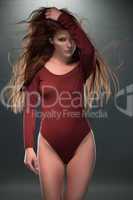 Seductive Woman Posing in Red Long Sleeved Leotard