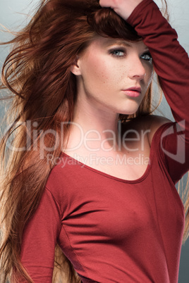Seductive Woman Posing in Red Long Sleeved Leotard