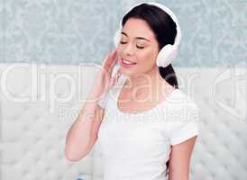 Gorgeous young woman listening to music