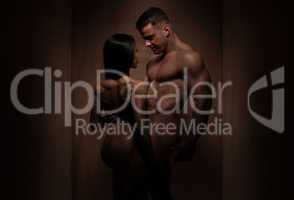 Naked Romantic Bodybuilding Couple in Silhouette