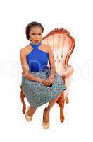 Gorgeous African woman in armchair.